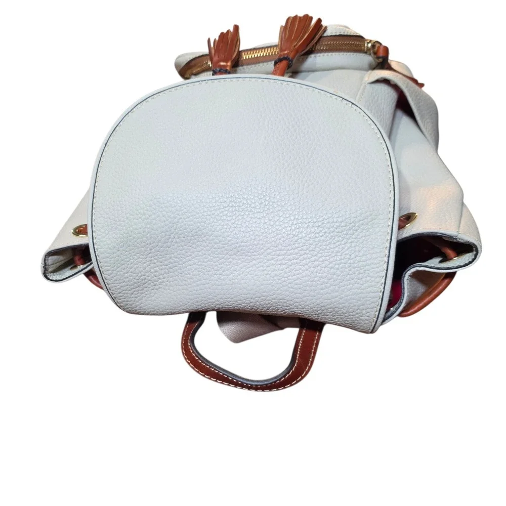 Dooney & Bourke Pebbled Leather Drawstring Backpack White Tan Tassel Logo